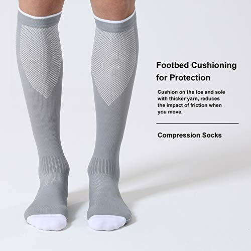 Person wearing gray compression socks with footbed cushioning.